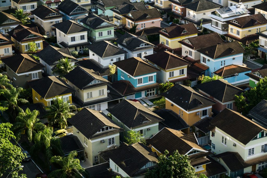 Image of a neighborhood with 1 blue house standing out of the crowd of houses